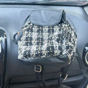 White and black backpack style purse( price negotiable)